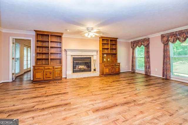 a bathroom with a granite countertop toilet a sink and a mirror