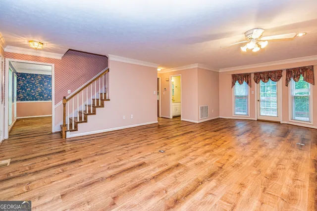 a kitchen with stainless steel appliances a refrigerator and a stove top oven