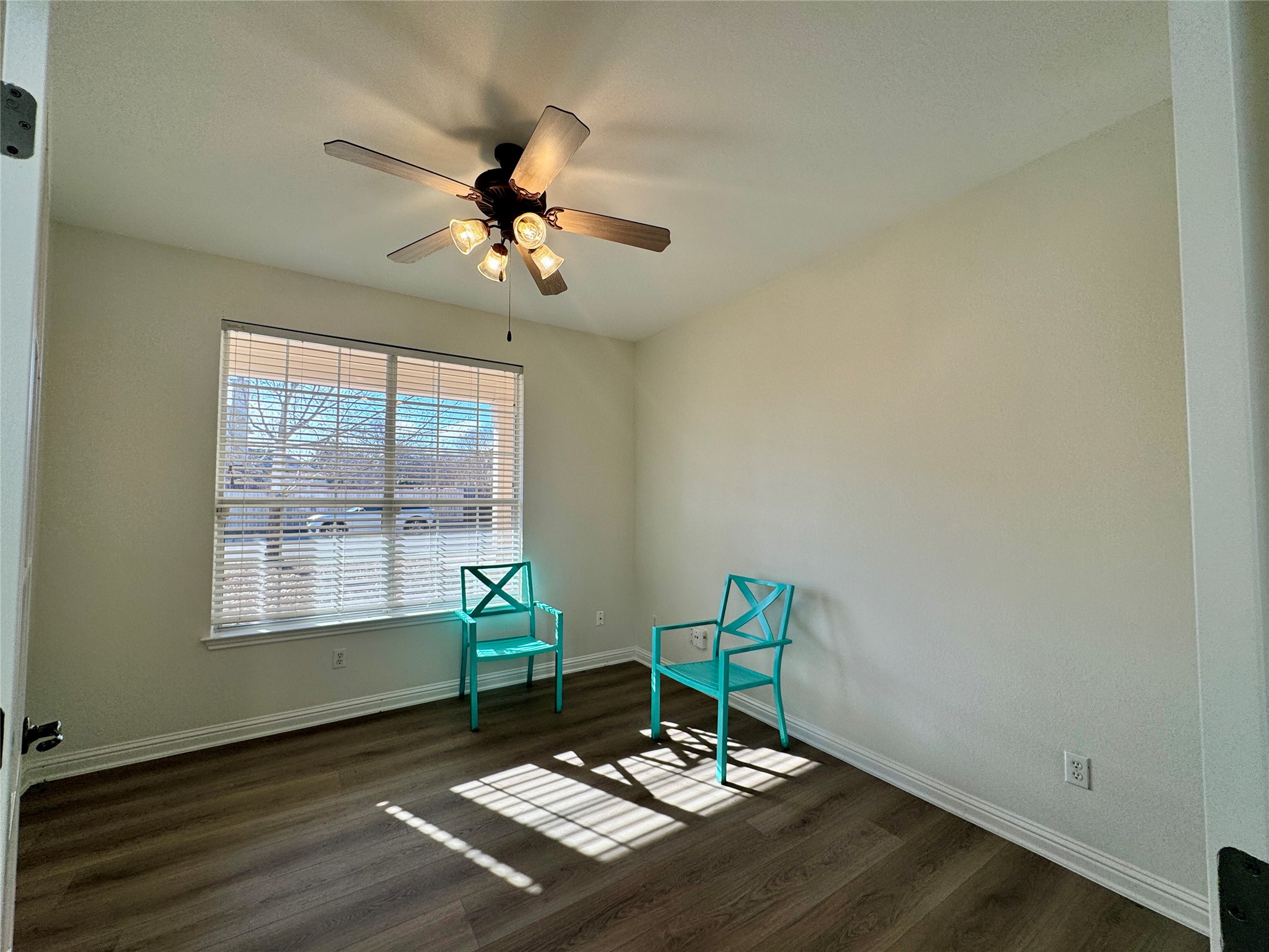 3640 Fossilwood Way Round Rock, TX 78681 - Photo 4 of 19 Living area featuring dark wood-type flooring and a ceiling fan