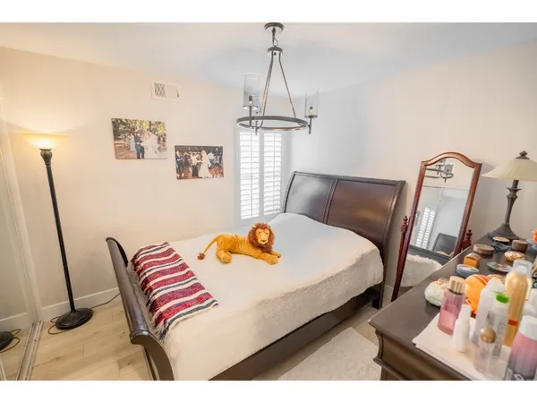 a bedroom with furniture and a window