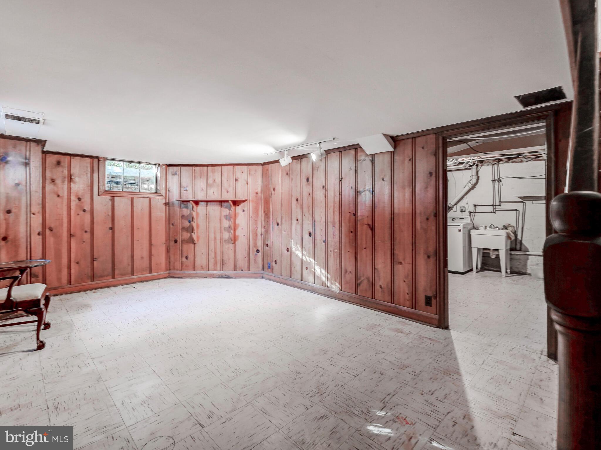 208 North Tyrone Road Baltimore, MD 21212 - Photo 22 of 28 Pine paneled basement room