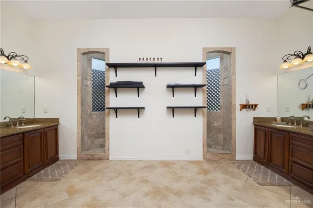 a view of kitchen with stainless steel appliances granite countertop a sink and a refrigerator