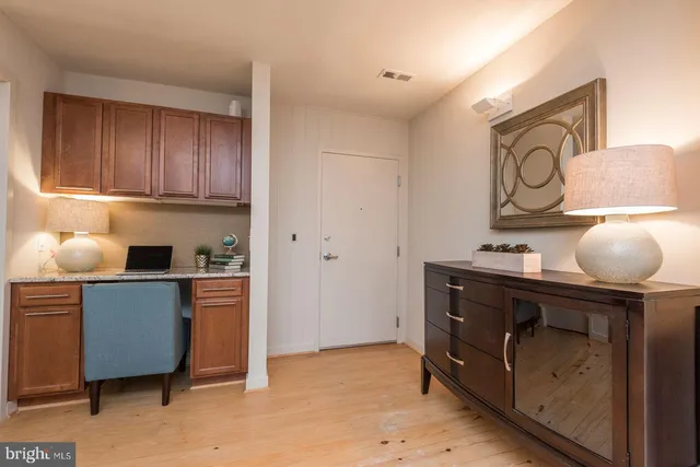 a kitchen with stainless steel appliances granite countertop a sink dishwasher stove and cabinets