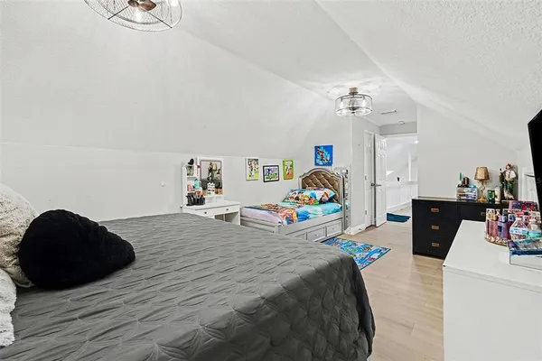 a bedroom with a bed and a table in it