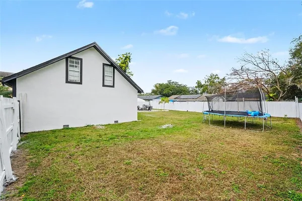 a backyard of a house with lots of green space