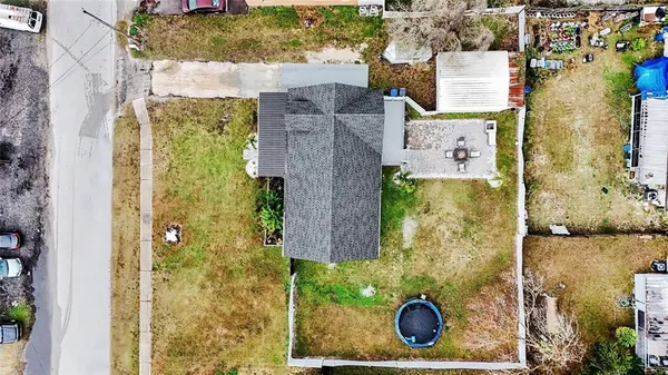 aerial view of a house with fountain in front of it