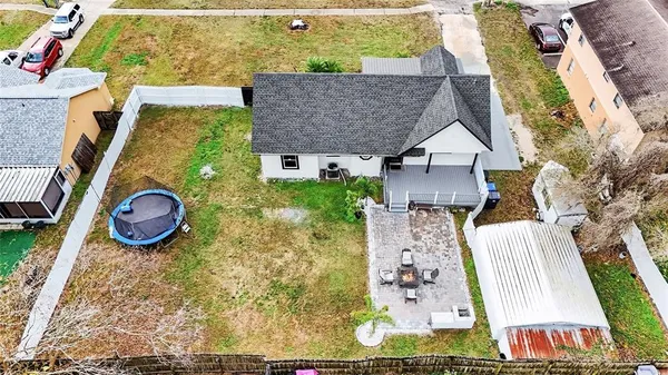 an aerial view of a house with garden space and sitting space