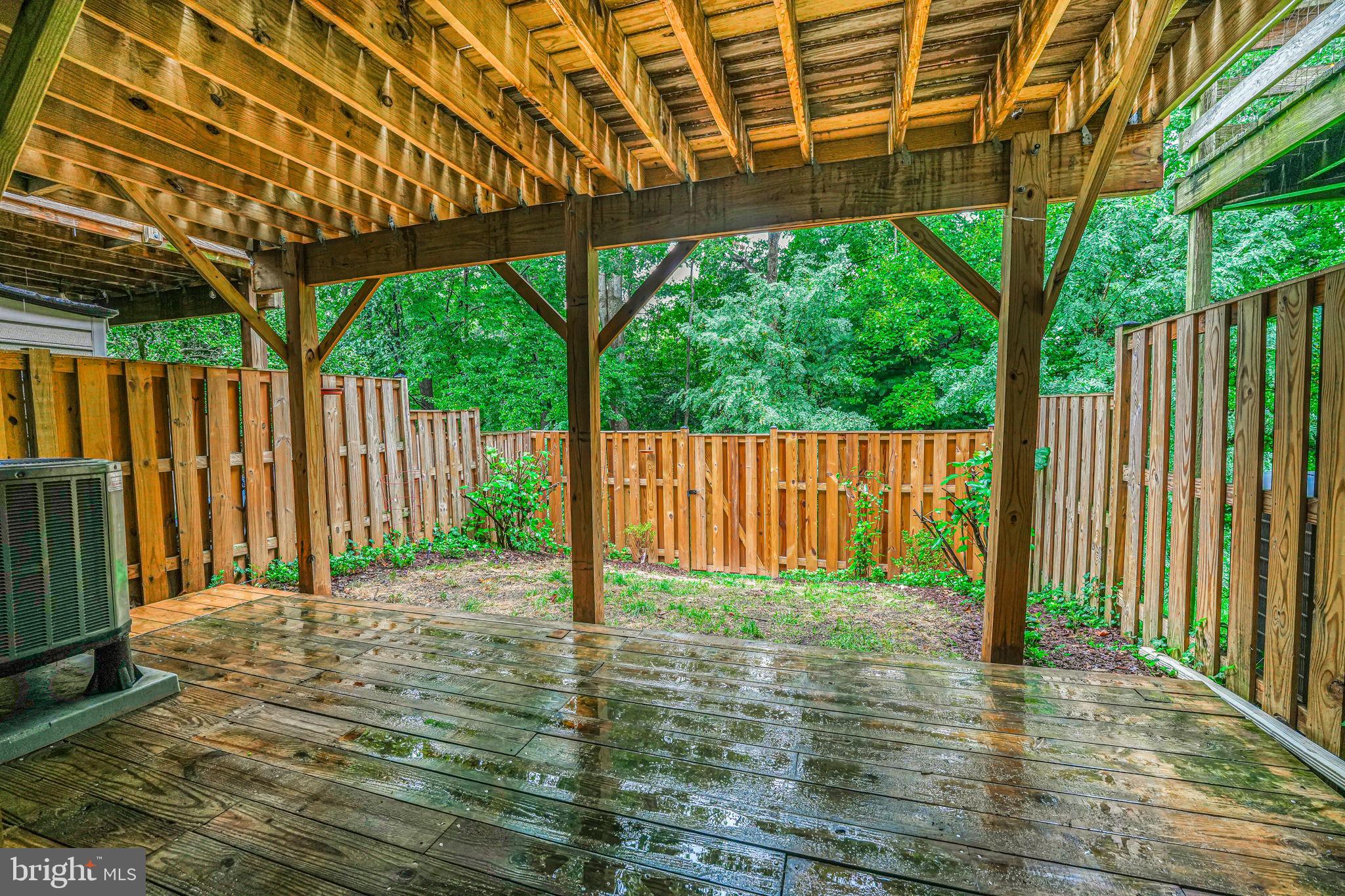 11014 Granby Court Reston, VA 20191 - Photo 34 of 46 Fenced yard has deck and grass/landscaping space.