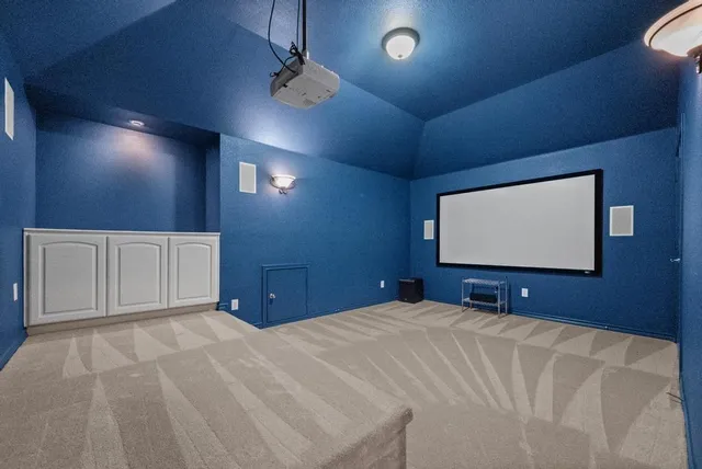 a bedroom with a bed and a projector