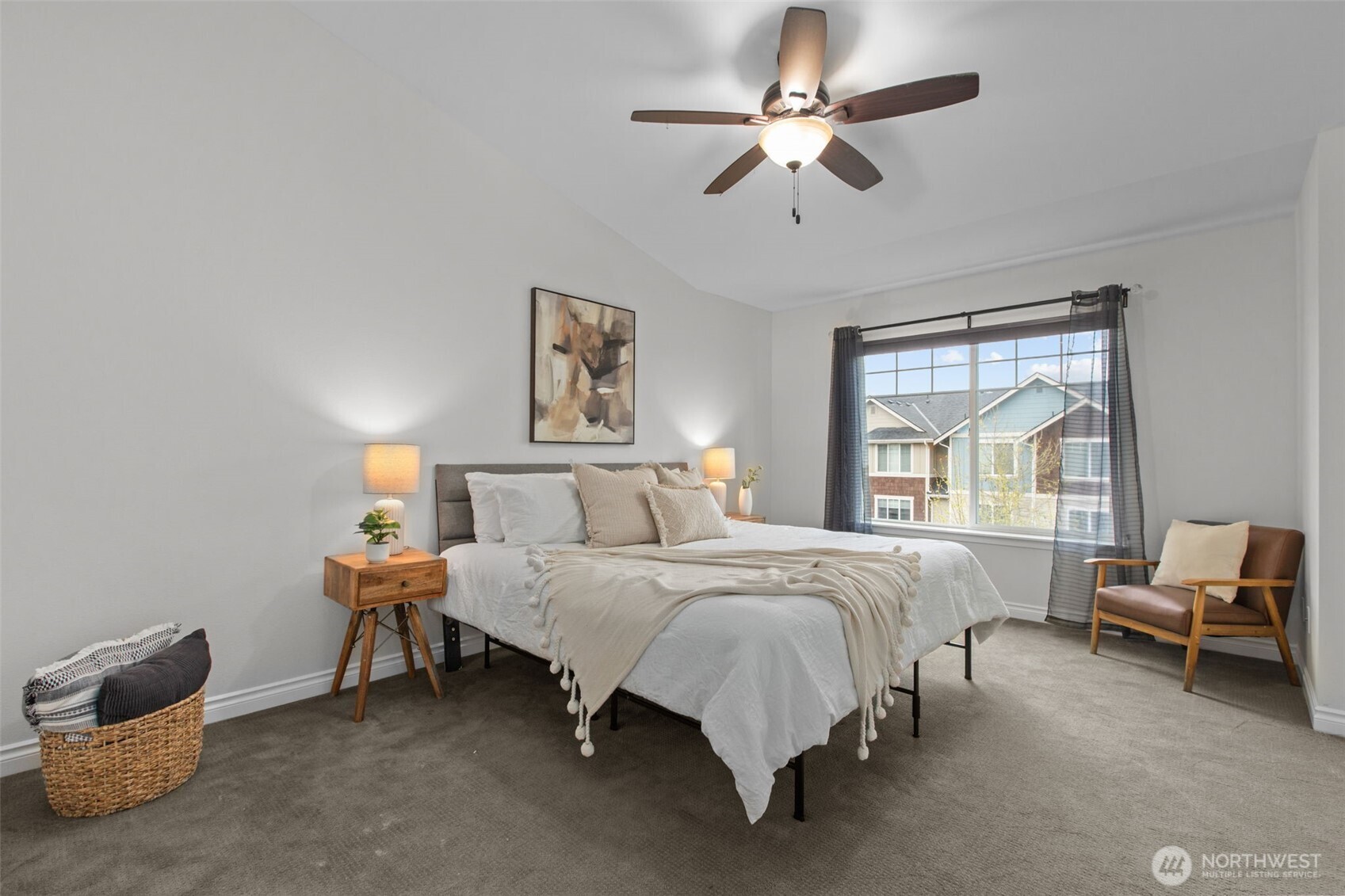 532 Pilchuck Path Everett, WA 98201 - Photo 18 of 37 a bedroom with a bed a chandelier and a window
