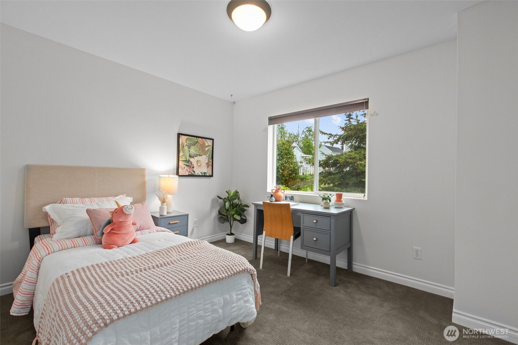 532 Pilchuck Path Everett, WA 98201 - Photo 20 of 37 a bedroom with a bed and a table