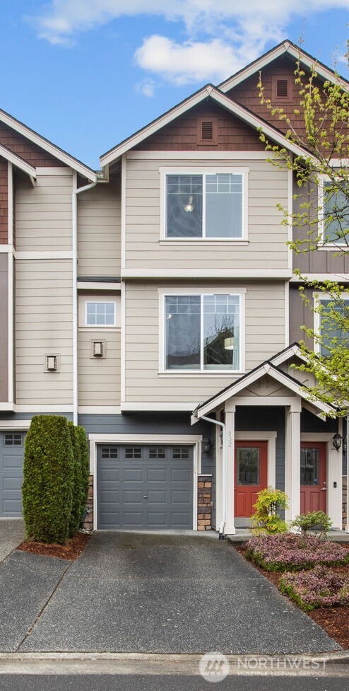 532 Pilchuck Path Everett, WA 98201 - Photo 2 of 37 a front view of a house with a garage
