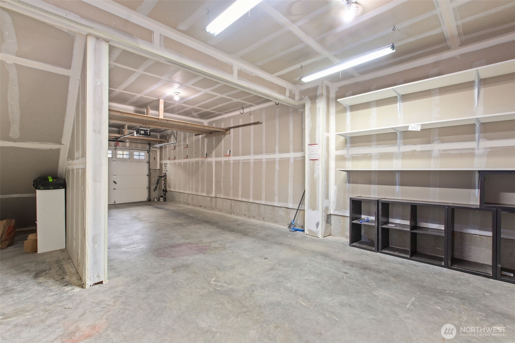 532 Pilchuck Path Everett, WA 98201 - Photo 28 of 37 a view of an empty room with a garage