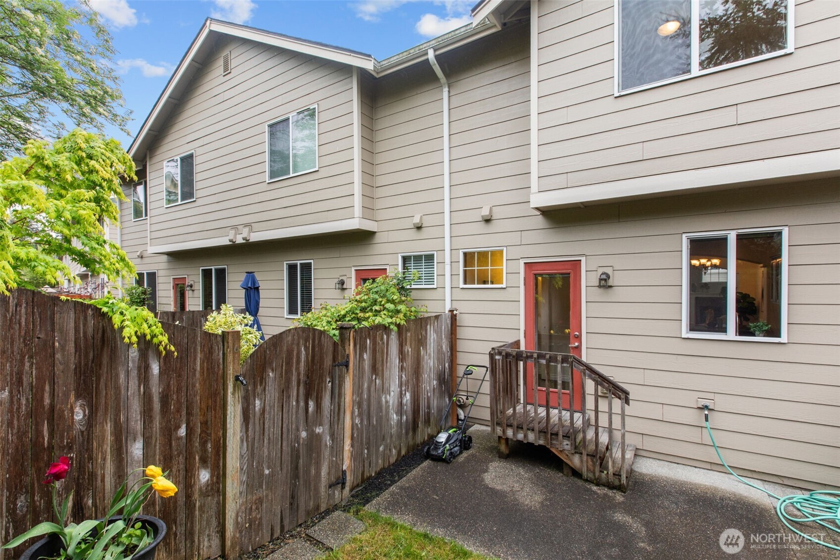 532 Pilchuck Path Everett, WA 98201 - Photo 30 of 37 a view of a house with a backyard and wooden fence