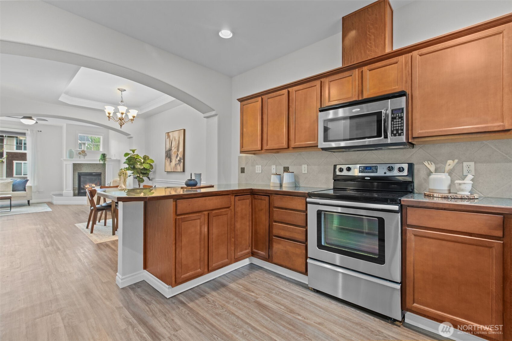 532 Pilchuck Path Everett, WA 98201 - Photo 3 of 37 a kitchen with stainless steel appliances granite countertop a stove a sink dishwasher and microwave oven with cabinets