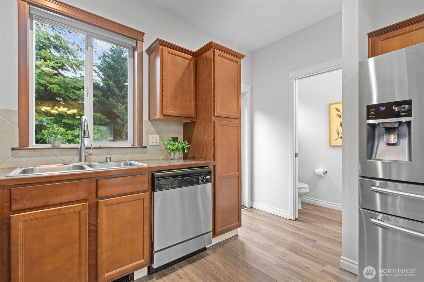 532 Pilchuck Path Everett, WA 98201 - Photo 5 of 37 a kitchen with stainless steel appliances granite countertop a refrigerator and a sink