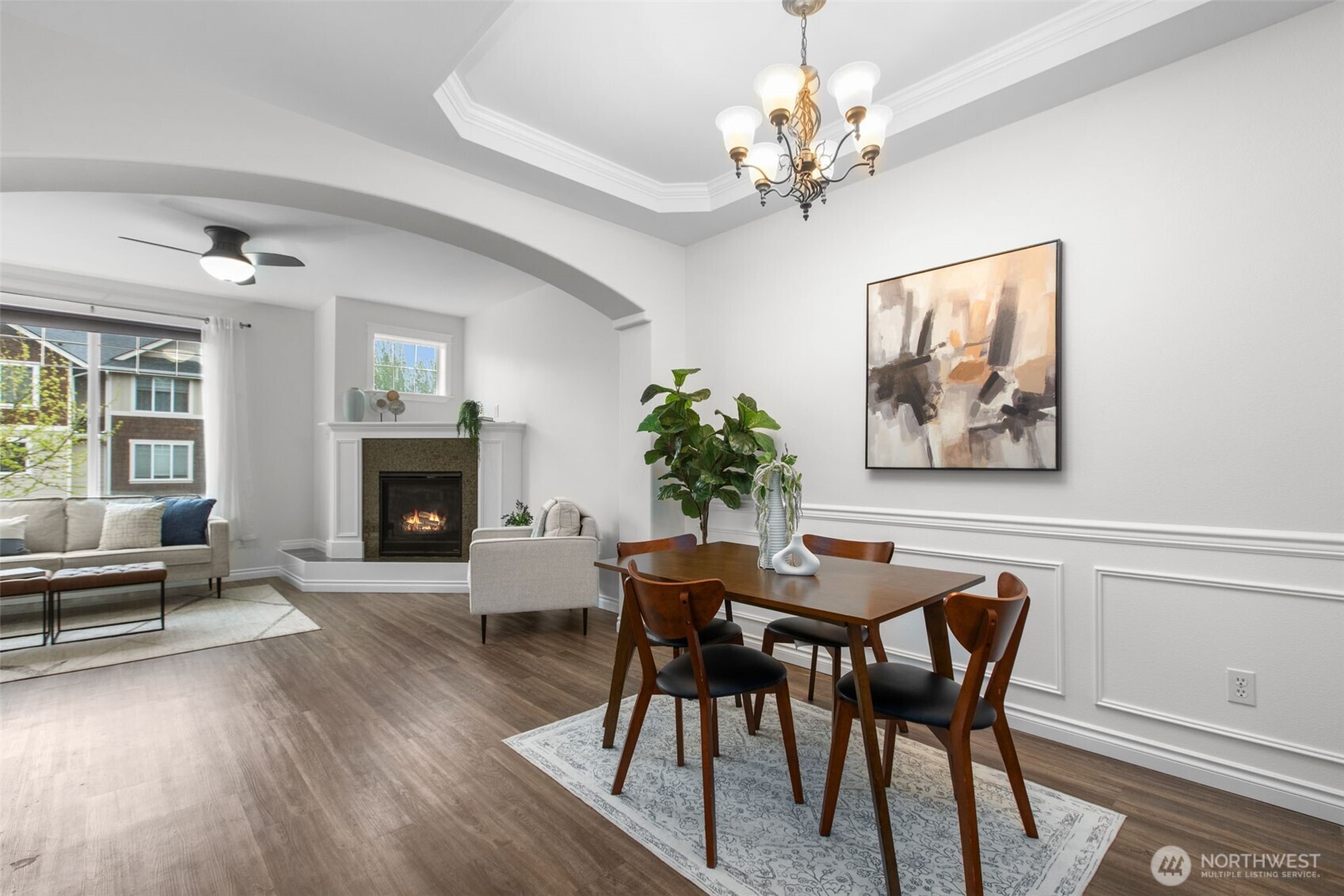 532 Pilchuck Path Everett, WA 98201 - Photo 10 of 37 a dining room with furniture a fireplace and wooden floor