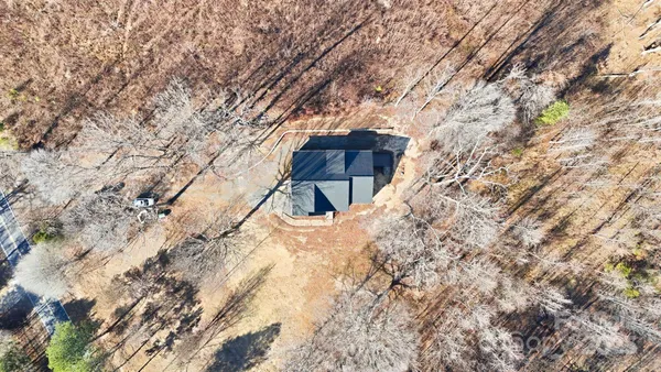 a backyard of a house with large trees