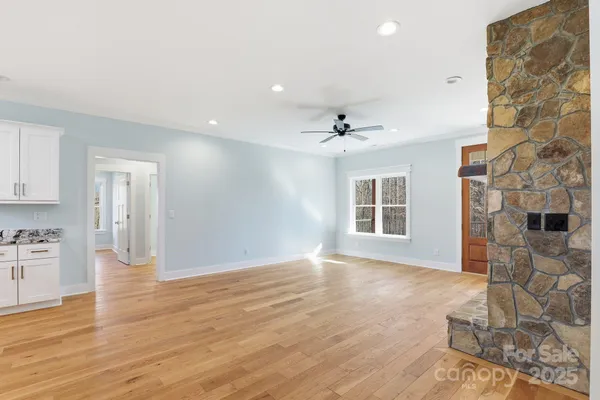 a view of livingroom with hardwood floor and a ceiling fan