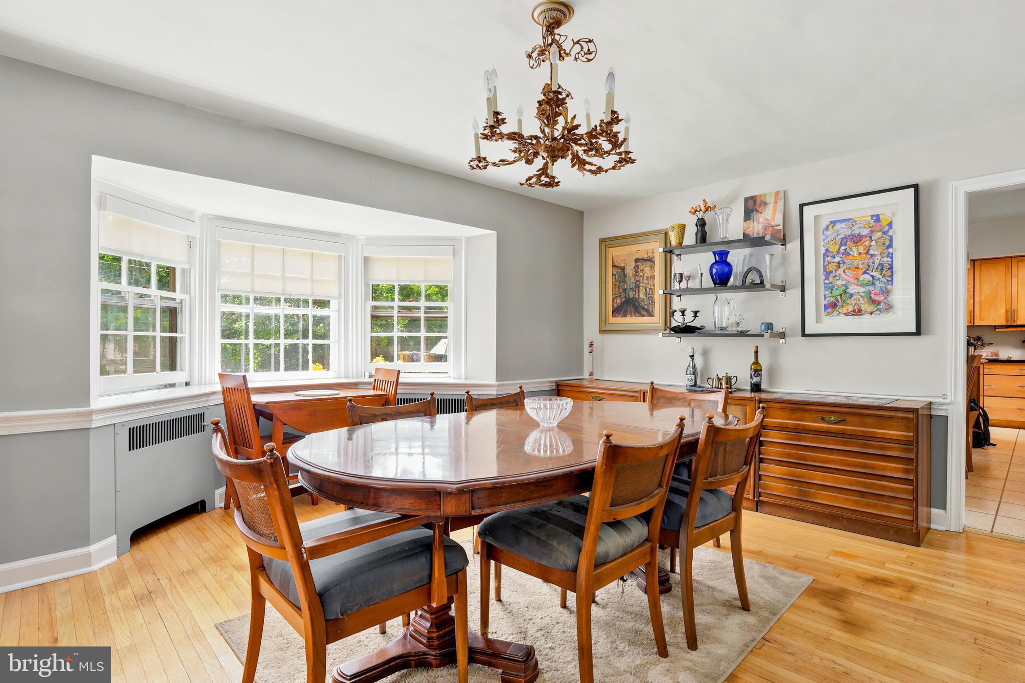 284 Trent Road Wynnewood, PA 19096 - Photo 6 of 31 a dining room with furniture a chandelier and wooden floor