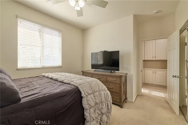 a bedroom with a bed and a television in it