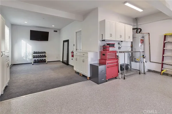 a view of room with furniture and a flat screen tv