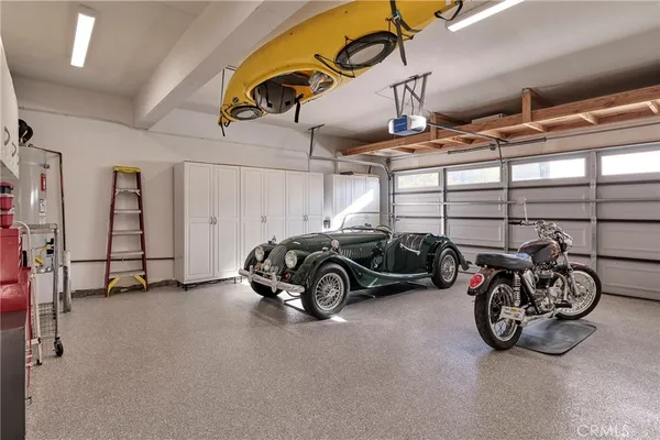 a view of parking garage with cars