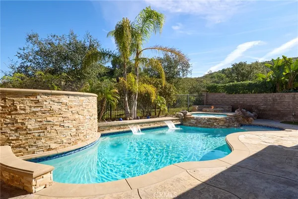a view of a swimming pool with a patio
