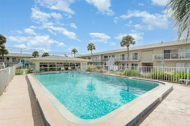 a view of yard with seating area and trees