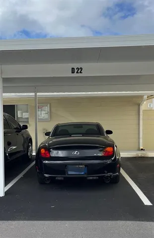 a front view of a building with a garden