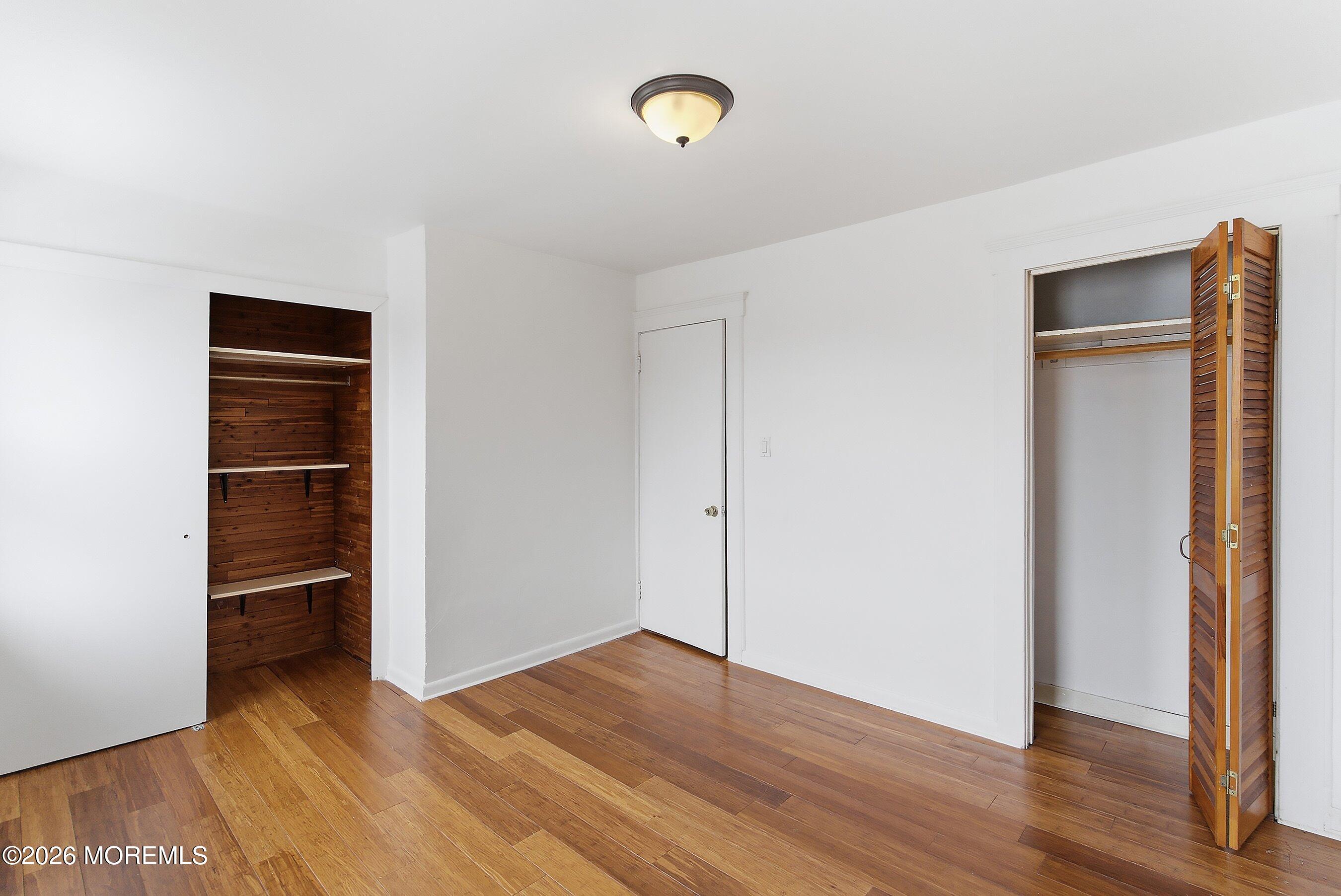 46 West 12th Street Linden, NJ 07036 - Photo 15 of 18 a view of walk in closet with wooden floor
