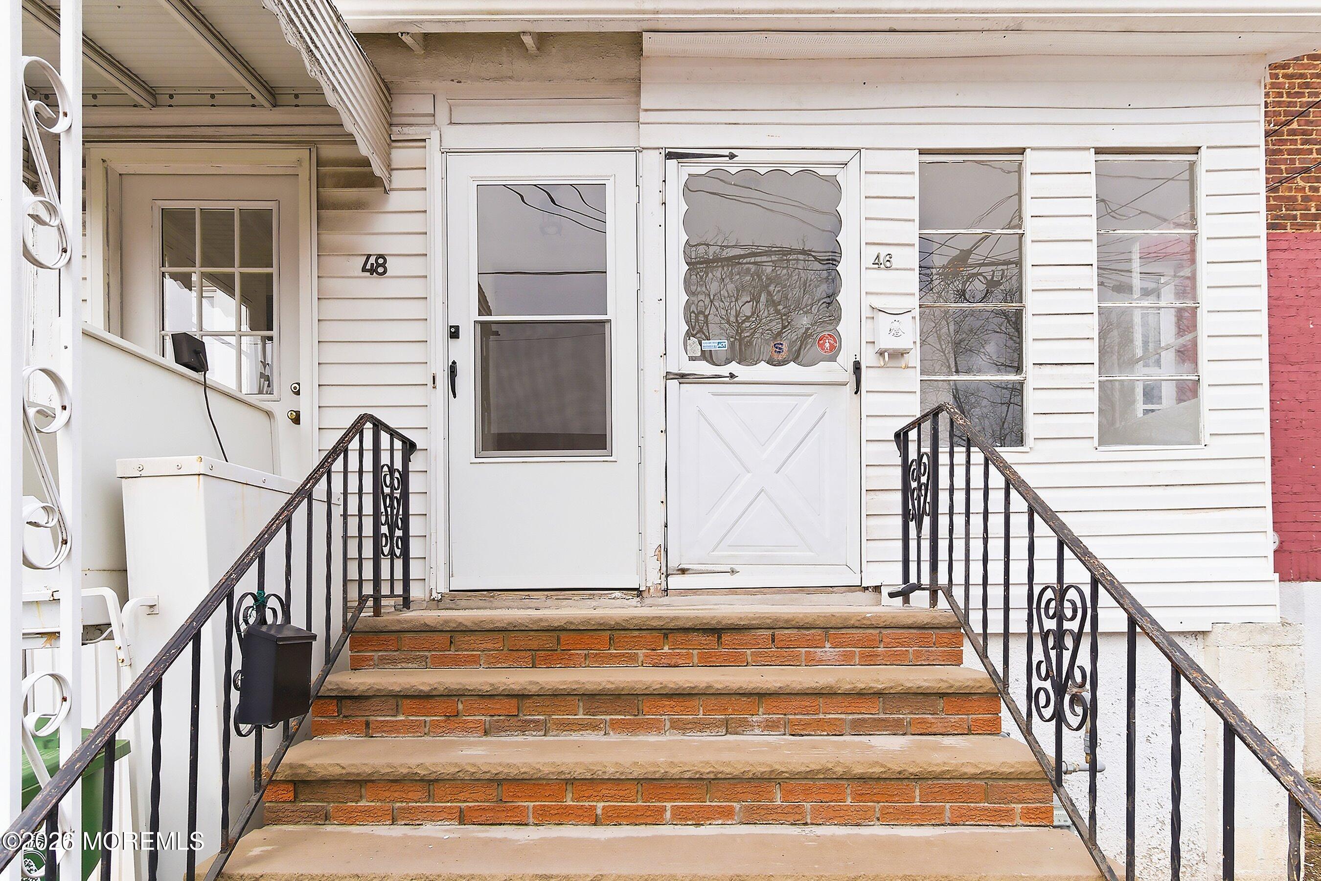 46 West 12th Street Linden, NJ 07036 - Photo 2 of 18 a view of staircase with railing and a window