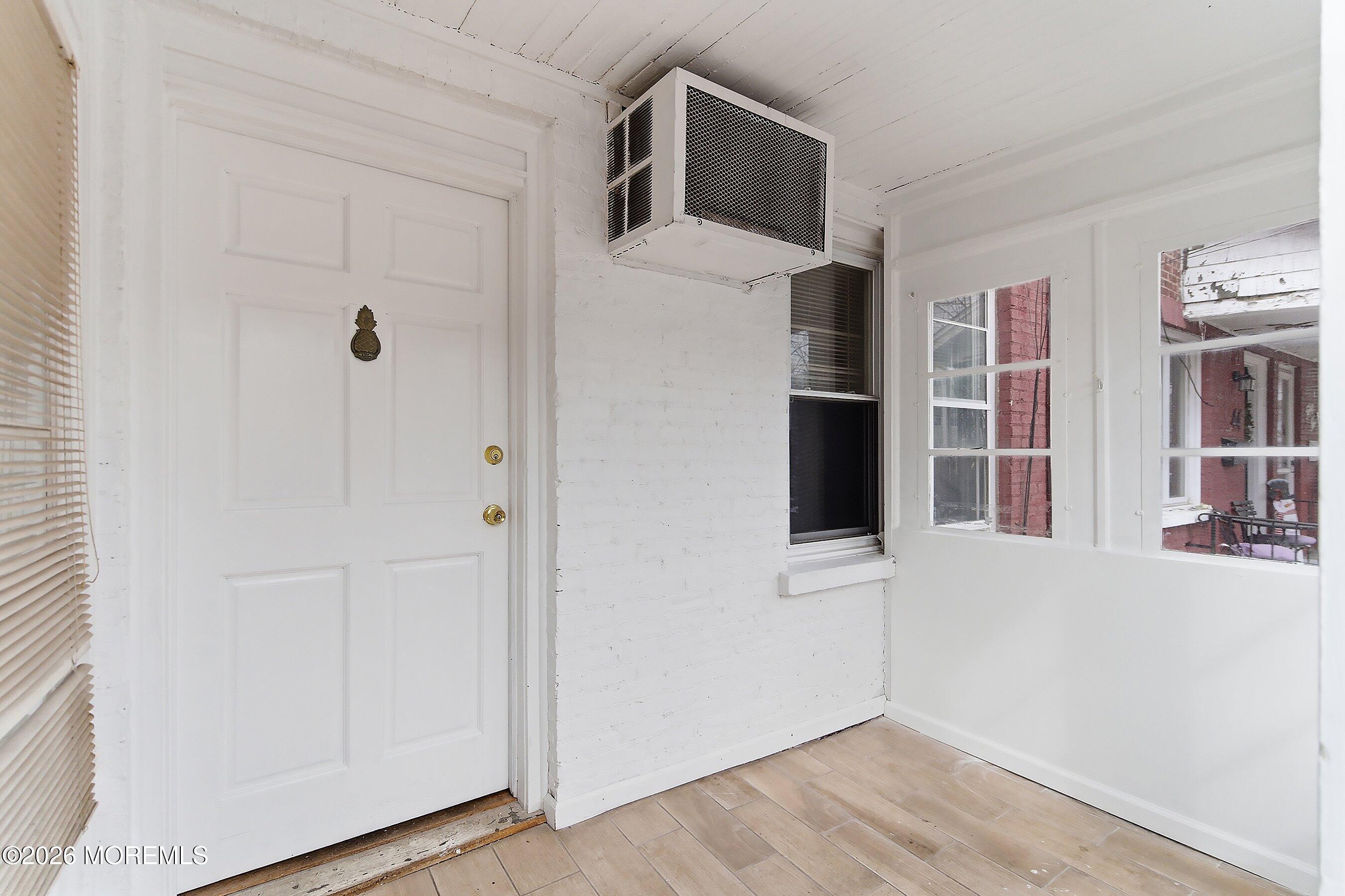 46 West 12th Street Linden, NJ 07036 - Photo 4 of 18 a view of a hallway with wooden floor and entryway