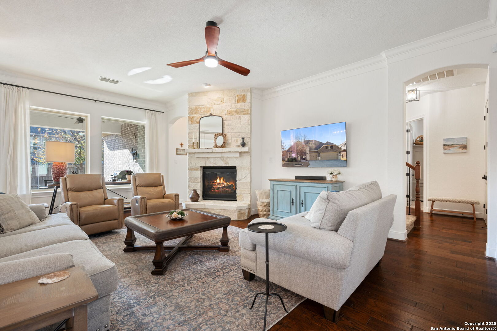 28827 Pfeiffers Gate Fair Oaks Ranch, TX 78015 - Photo 13 of 36 a living room with furniture and a fireplace