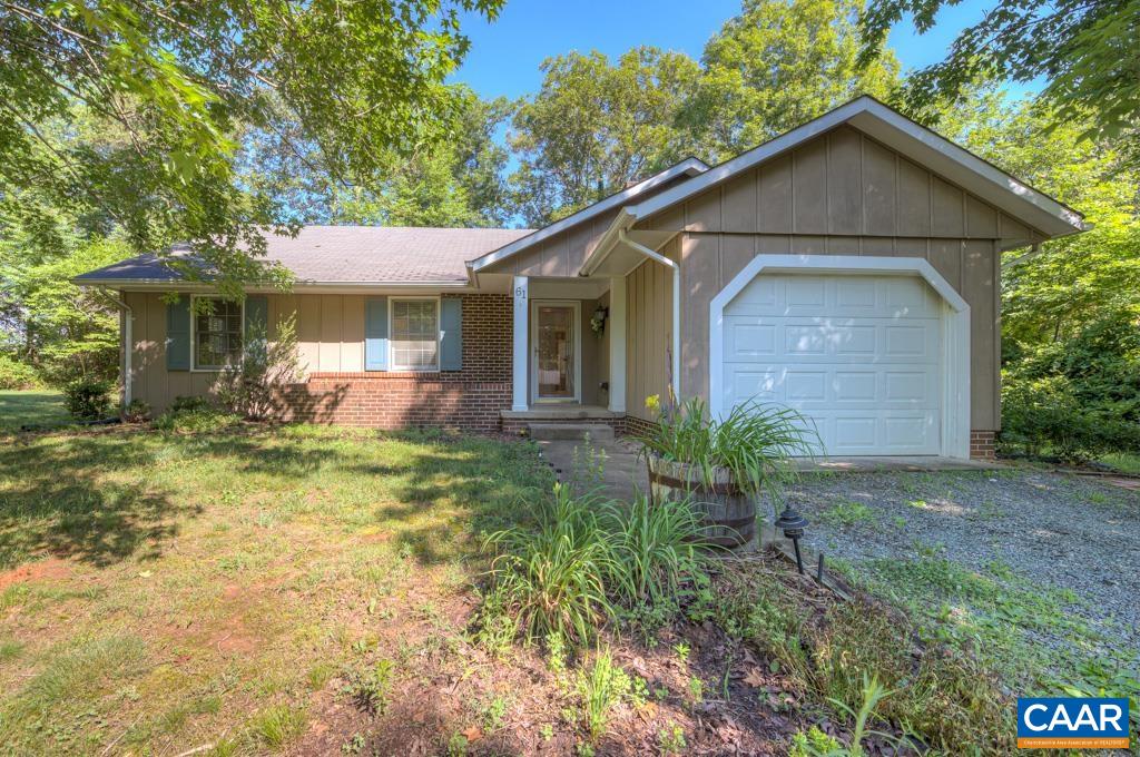 61 Pinewood Court Ruckersville, VA 22968 - Photo 1 of 24 a front view of a house with garden