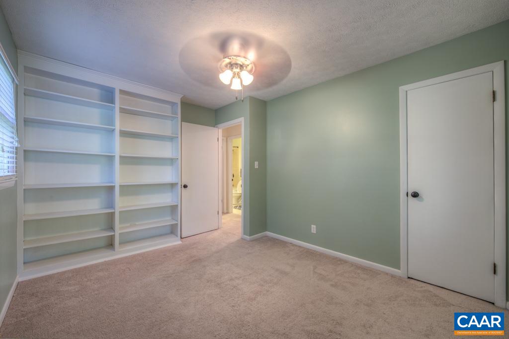 61 Pinewood Court Ruckersville, VA 22968 - Photo 15 of 24 a view of an empty room with a chandelier