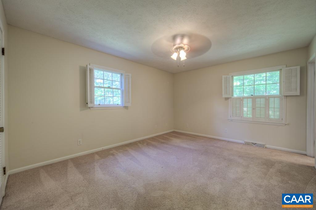 61 Pinewood Court Ruckersville, VA 22968 - Photo 17 of 24 an empty room with a empty space and windows