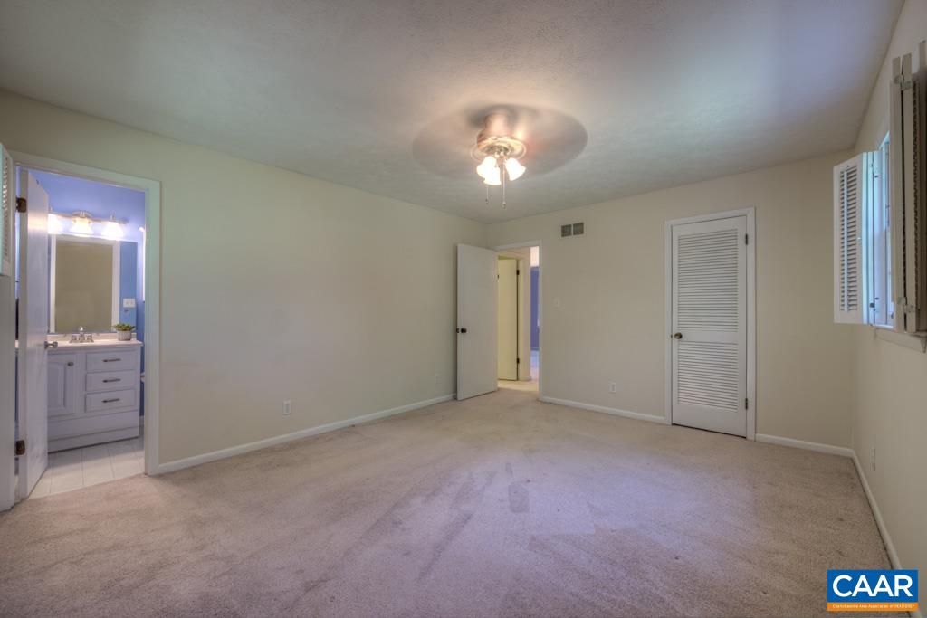 61 Pinewood Court Ruckersville, VA 22968 - Photo 18 of 24 an empty room with a bathroom