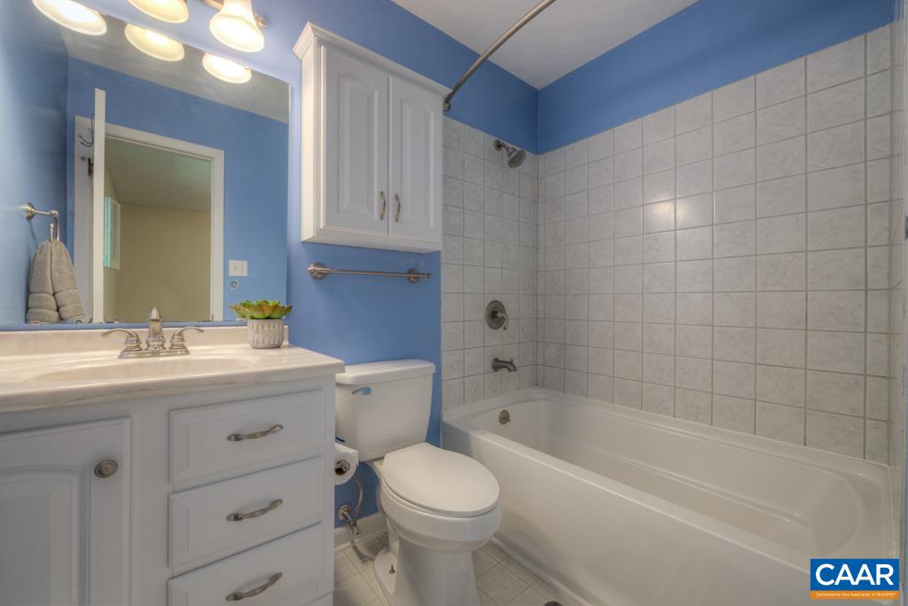 61 Pinewood Court Ruckersville, VA 22968 - Photo 19 of 24 a bathroom with a granite countertop toilet a sink and bathtub