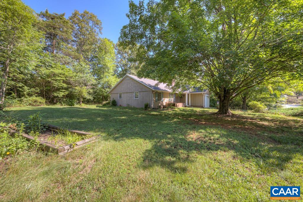 61 Pinewood Court Ruckersville, VA 22968 - Photo 20 of 24 a front view of a house with garden
