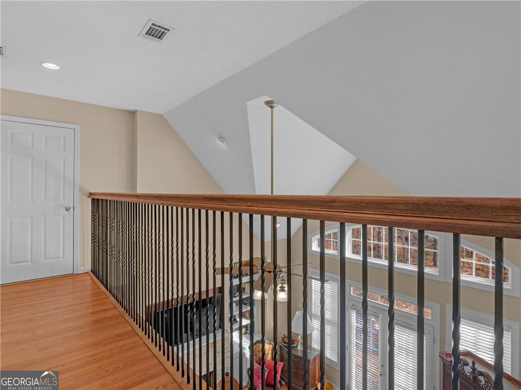 355 Parker Road Covington, GA 30014 - Photo 32 of 60 a view of a hallway with wooden floor