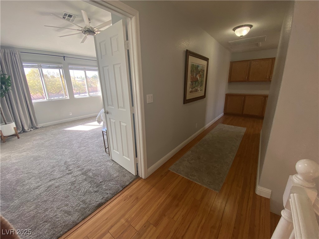 10637 Amblewood Avenue Las Vegas, NV 89144 - Photo 14 of 32 Corridor featuring light wood-type flooring and baseboards