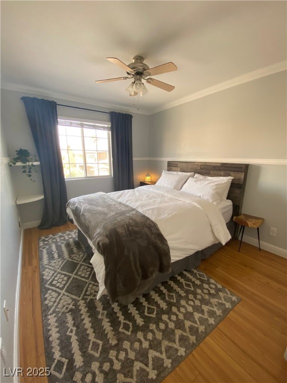 10637 Amblewood Avenue Las Vegas, NV 89144 - Photo 16 of 32 Bedroom featuring ornamental molding, wood finished floors, and ceiling fan