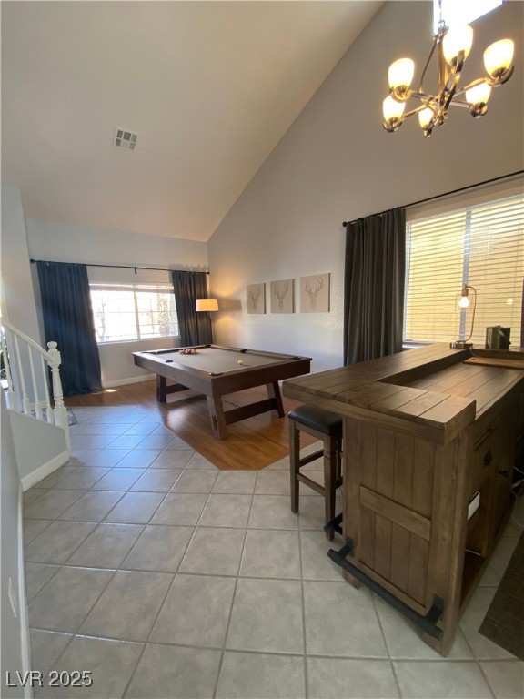 10637 Amblewood Avenue Las Vegas, NV 89144 - Photo 20 of 32 Playroom featuring high vaulted ceiling, a chandelier, light tile patterned flooring, and billiards