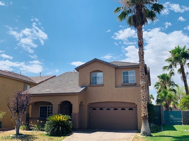 10637 Amblewood Avenue Las Vegas, NV 89144 - Photo 2 of 32 View of front of home with stucco siding, driveway, and a garage