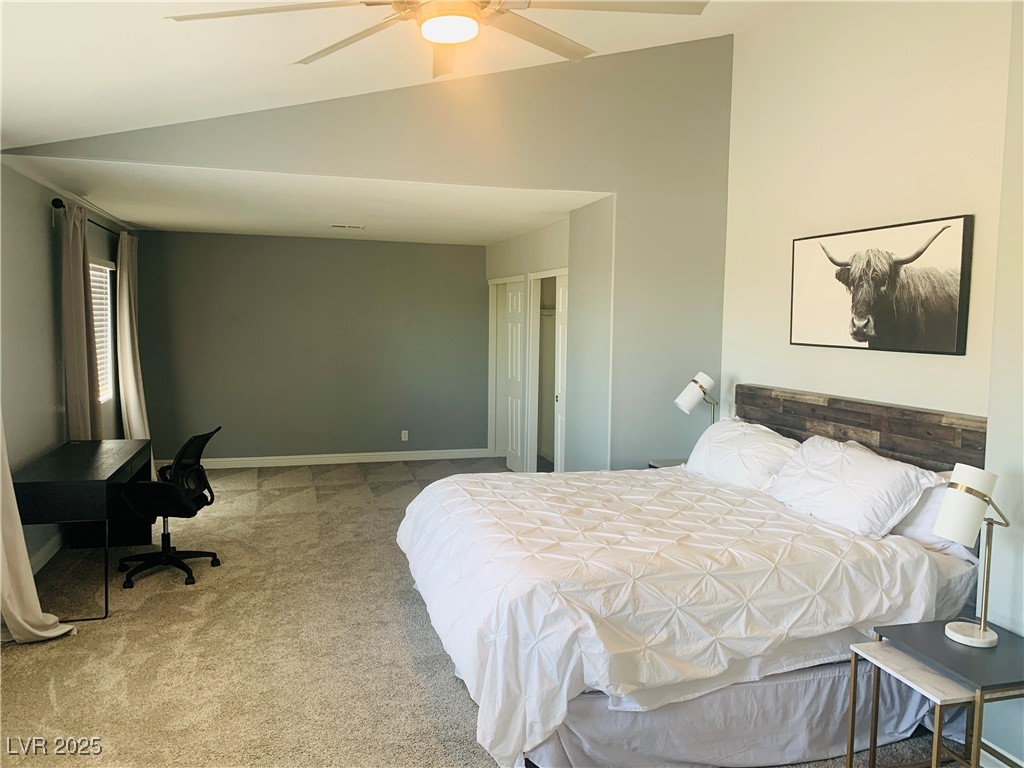 10637 Amblewood Avenue Las Vegas, NV 89144 - Photo 3 of 32 Bedroom featuring lofted ceiling, carpet floors, and ceiling fan