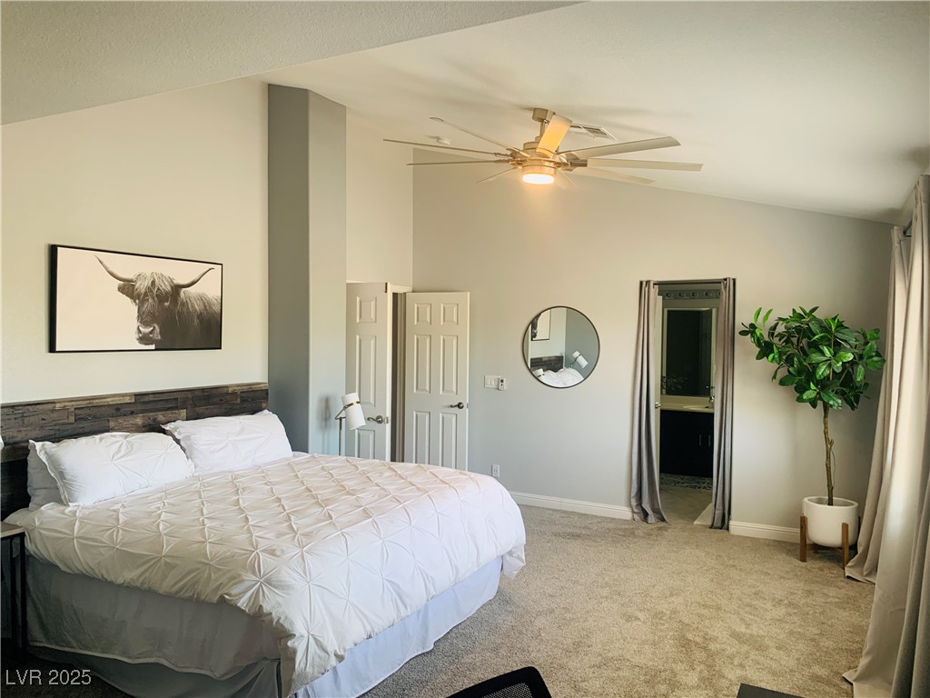 10637 Amblewood Avenue Las Vegas, NV 89144 - Photo 4 of 32 Bedroom with light carpet, high vaulted ceiling, and a ceiling fan