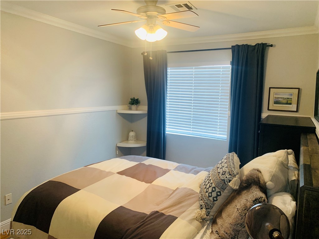 10637 Amblewood Avenue Las Vegas, NV 89144 - Photo 7 of 32 Bedroom featuring crown molding and ceiling fan