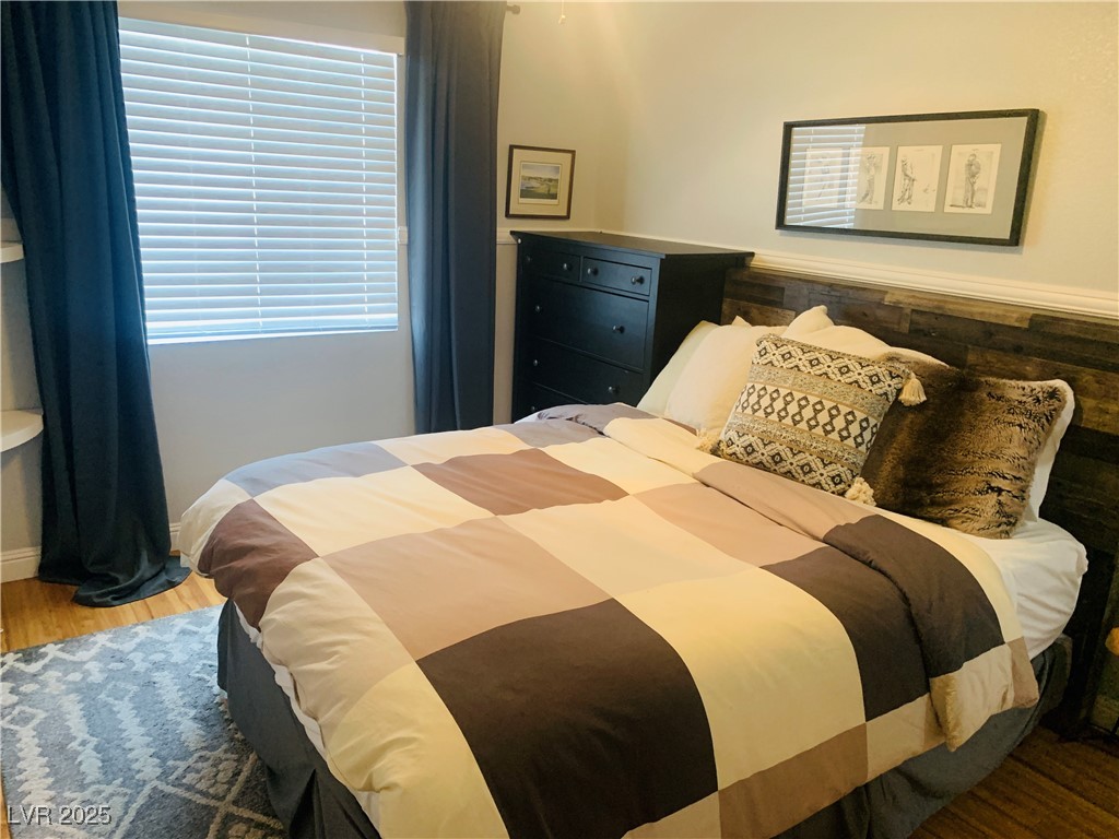 10637 Amblewood Avenue Las Vegas, NV 89144 - Photo 8 of 32 Bedroom with light wood-style floors