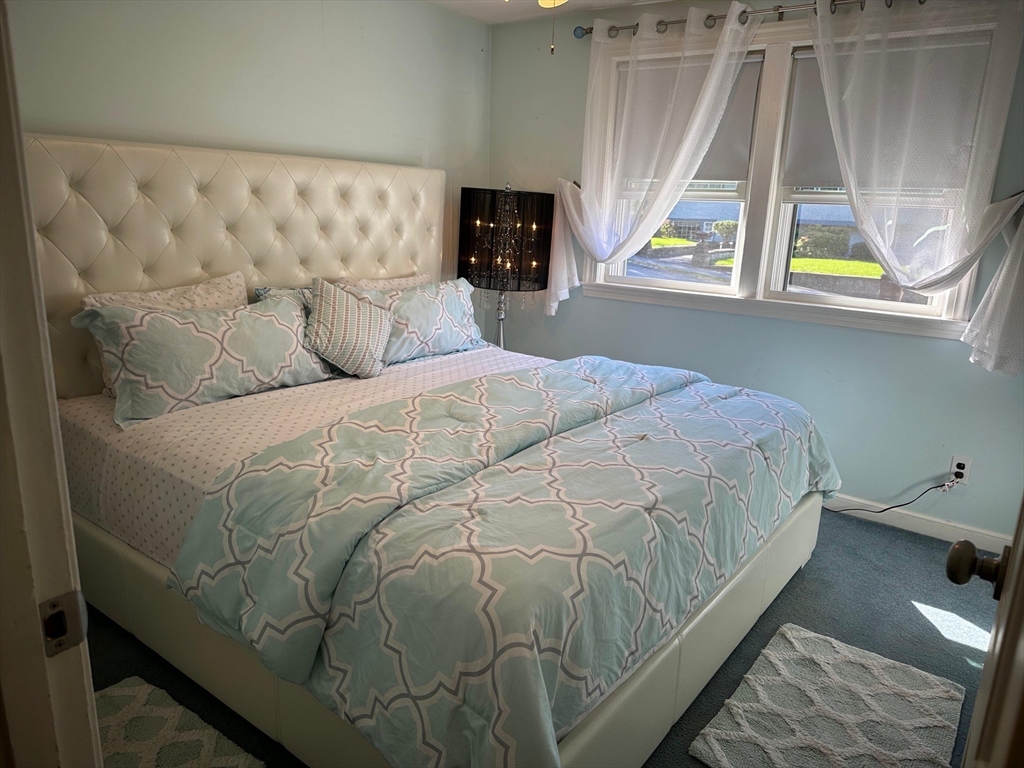 223 Robert Road Dedham, MA 02026 - Photo 12 of 18 a bedroom with a bed and a window